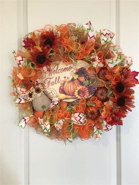 Learn how to make a DIY Dollar Tree Fall Wreath for less than 20 that features silk florals, glitter pumpkins, an acorn and an owl. . Dollar tree fall wreaths 2022